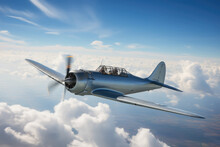 Silver Chrome Fuselage. Retro Vintage Single-engine Airplane. Spinning Propeller. Plaine In Flight. Small Generic WWII Aircraft. Blue Sky. Above The Clouds. Agricultural Plane