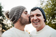 © Vane Nunes - Mature gay couple kissing outside - Male lovers taking selfie picture during fall or winter time - LGBTQ family relationship