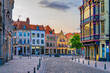 canvas print picture - Vieux Lille old town quarter with empty narrow cobblestone street, paving stone square with old colorful buildings in historical city centre, French Flanders, Hauts-de-France Region, Northern France