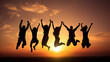 Black silhouettes in front of an orange sunset of a cheering group jumping in the air for joy at a shared success