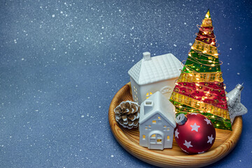 Sticker - wooden tray with christmas ornaments and fir tree with glowing holiday lights. christmas and new year decorations