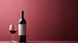 Red wine bottle with a glass on a simple empty background