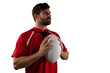 Digital png photo of focused latino rugby player with ball on transparent background