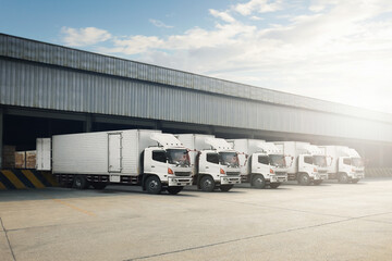 Container Trucks Parked Loading Package Boxes at Dock Warehouse. Cargo Container. Distribution Warehouse Shipping. Supply Chain, Shipment Boxes. Freight Truck Logistics, Cargo Transport.