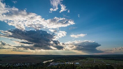 Wall Mural - beautiful movement of fluffy clouds with clear blue sky. dramatic clouds at sunset, aerial view of s