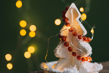 Wall Mural - white crystal grown christmas tree shapes with red beads opposite garlands.