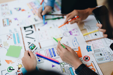 Wall Mural - Team of Creative Web, Graphic Designer planning for mobile phone, drawing website ux ui app for mobile phone application and development template layout, process to developing prototype wireframe.