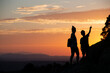 © SaucE ReQuEs - Silhouettes of a single-parent family on a sunset in the mountains