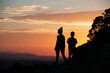 © SaucE ReQuEs - Silhouettes of a single-parent family on a sunset in the mountains