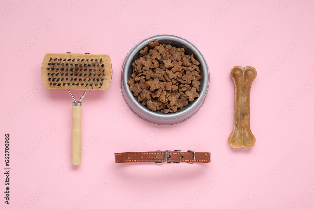 Composition with pet collar, grooming brush and food on pink background