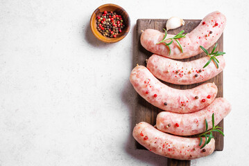 Canvas Print - Raw sausages with spices and rosemary