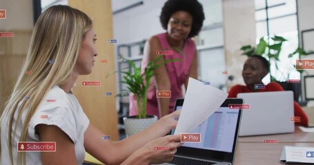 Poster - Animation of multiple notification bars over diverse female coworkers discussing reports on desk