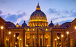 Vatican City (Holy See. Rome, Italy. Dome of St. Peters Basil cathedral at Saint Peter's Square. Evening sunset, golden hour with evening sky and street lamps.