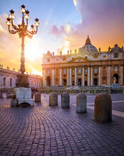 Vatican City Holy( See. Rome, Italy. Dome Of St. Peters Basil Cathedral At Saint Square. Evening Sunset, Golden Hour With Evening Sky And Street Lamps