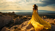 © UsamaR - Backside of a woman in a yellow long dress standing
