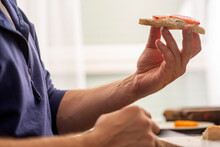 Male Hands Preparing A Sandwich With Cheese And Tomato