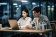 © Вячеслав Герц - Asian guy and girl are drinking coffee and working on a laptop. Work process, communication, ai