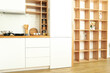 © Atlas - Modern kitchen in white colors and wooden shelves