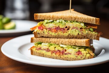 Sticker - triple decker sandwich on a white plate