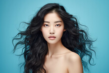 Generative AI Illustration Portrait Of Beautiful Young Asian Woman With Dark Long Wavy Hair And Nude Body Looking At Camera Against Blue Background