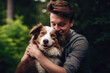 Photo of young male hugs the dog