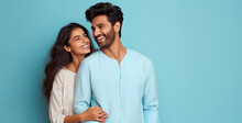Happy Indian Couple On The Studio Isolated Blue Background.