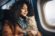 Indian woman sitting with cat while journey in air plane