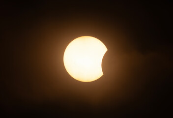 Wall Mural - partial annular solar eclipse through the clouds - october 14, 2023, kanata, ontario, canada