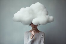 A sad woman hidden behind a cloud, concept of loneliness and depression