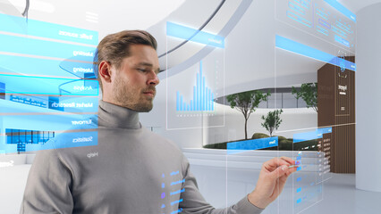 Fototapete - Handsome Man Standing in a Futuristic Virtual Space, Interacting with an Augmented Reality Hologram with Business Data, Financial Reports, Stock Market Statistics, Infographics and Charts