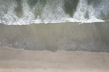 Sticker - Sea wave on shallow beach sand