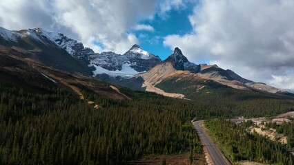 Wall Mural - the road in the mountain valley. traveling by car. landscape from the air. video for background. fal