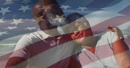 Wall Mural - Animation of flag of usa over happy senior biracial couple in love embracing on beach