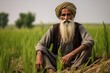 Portrait of a rural elderly Muslim man sitting on the grass