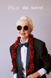 Beautiful stylish mature senior woman in sunglasses and tuxedo celebrating new year. Fun, party, style, celebration concept