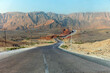 Highway along high lifeless mountains in Oman