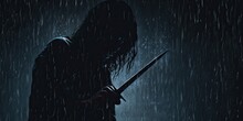 Silhouette Of A Person With A Knife In The Dark Rain