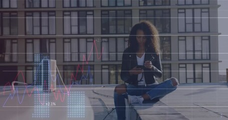 Poster - Animation of graphs and changing numbers over biracial woman sitting outdoor and using cellphone