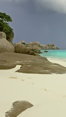 Wall Mural - landscape with white sand beach and storm sky on similan islands, thailand. vertical video