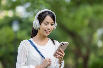 Wall Mural - Sport woman listen to music with headphone