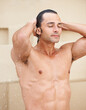 © Marine Gastineau/peopleimages.com - Shower, wellness and man with water for cleaning, washing hair and grooming for healthy skin. Beauty, spa treatment and person with splash for hygiene, satisfaction and skincare hydration or cleanse