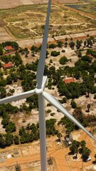 Wall Mural - Aerial drone of Wind turbines on the coastline. Wind power plant. Jaffna, Sri Lanka.