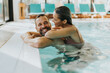 © BGStock72 - Young couple relaxing in the indoor swimming pool