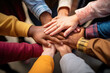 Group of mix race people joining hands together in a circle supporting each other, symbolizing unity