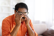 © Prostock-studio - Tired indian mature man rubbing eyes, home interior
