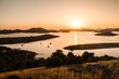 Beautiful sunset over the famous Kornati national park in Croatia, Europe, view from the top of the Zut island, sailboats on the sea