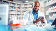 © BlazingDesigns - African American pharmacist selling medications in the pharmacy store.