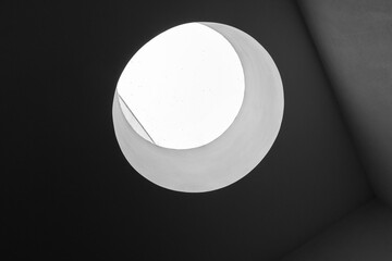 Wall Mural - Abstract minimal interior with round skylight portal, black and white