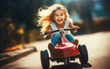 Fototapeta  - Young girl kid driving a little pedal car