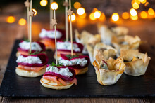 Christmas Canapes With Blinis With Salmon, Beetroot And Goat Cheese And Filo Pastry Cups